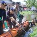 Polda Jambi Gotong Royong Bersihkan Aliran Sungai di Parit II Tanjabbar. (Foto : ist)
