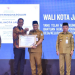 Wali Kota Maulana Raih Penghargaan Dari Menteri Hukum RI Atas Dukungan Hadirnya Pos Bantuan Hukum di Semua Kelurahan Kota Jambi. (Foto : ist)
